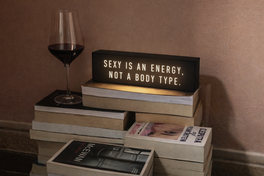illuminated sign ''sexy is an energy, not a body type''