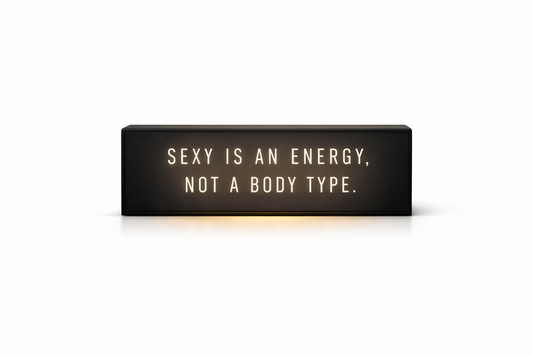 illuminated sign ''sexy is an energy, not a body type''